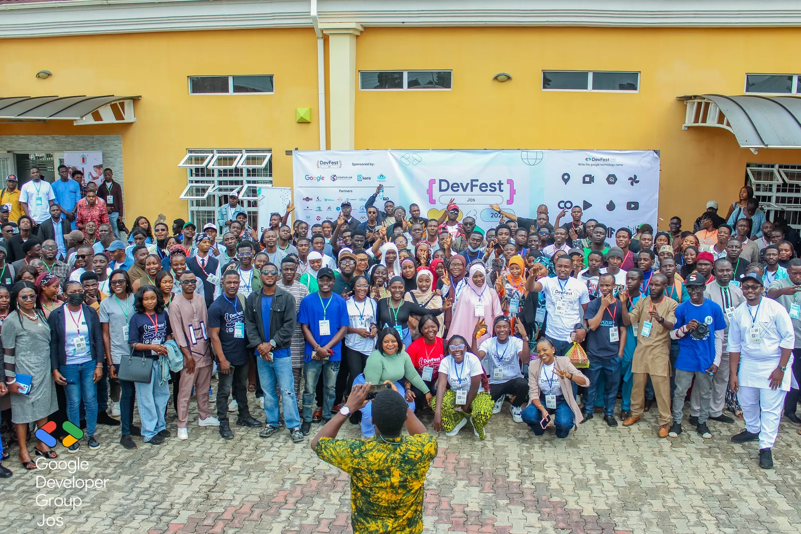 The DevFest Jos 2025 group photo outside the venue