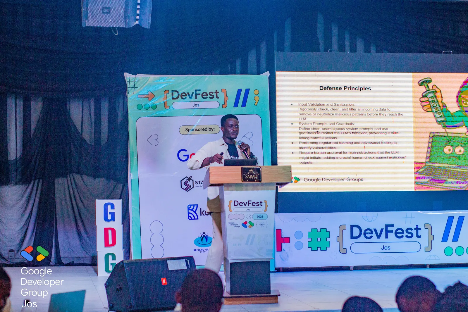 A speaker at the podium during DevFest Jos 2025